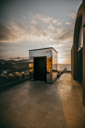 Exterior view of the Sunshine Bay residence at sunset, highlighting its minimalist Japanese architecture.