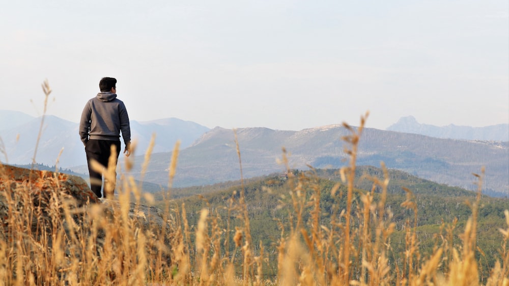 a man walking in a field