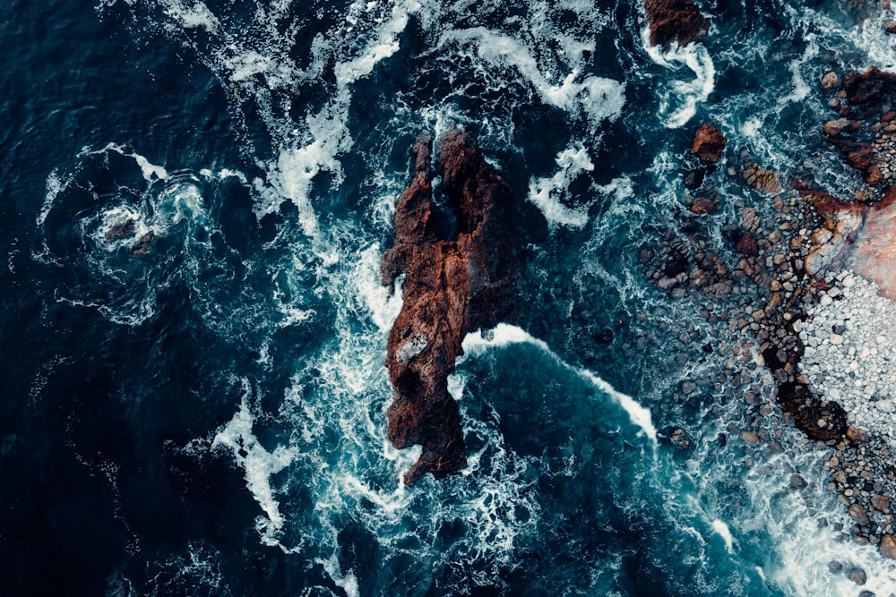 a rocky beach with waves crashing