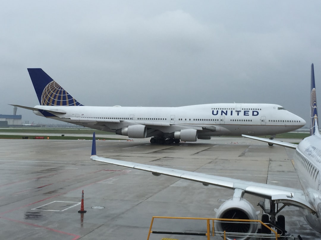 a large airplane is parked at an airport, Queen Of The Sky