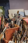 a bunch of brushes in a box