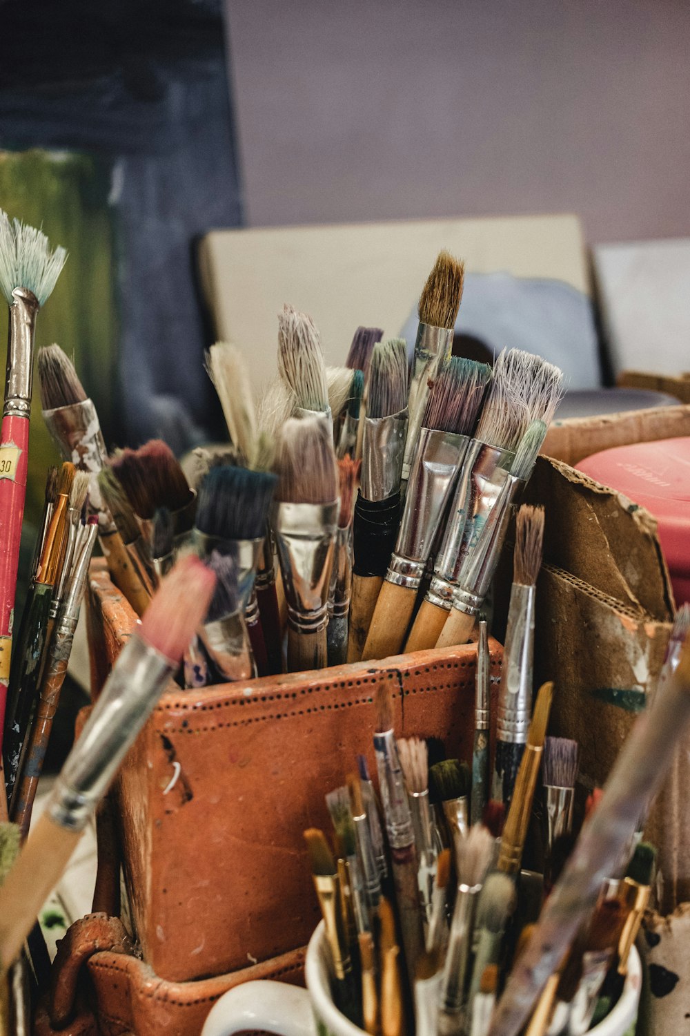 a bunch of brushes in a box