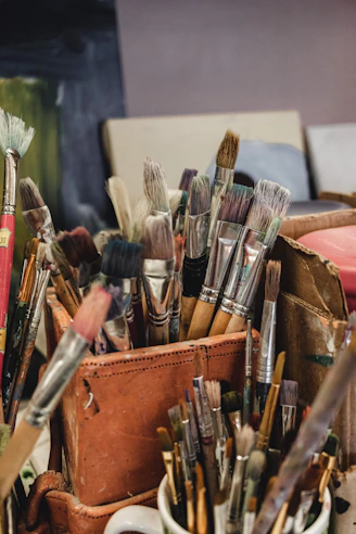 a bunch of brushes in a box