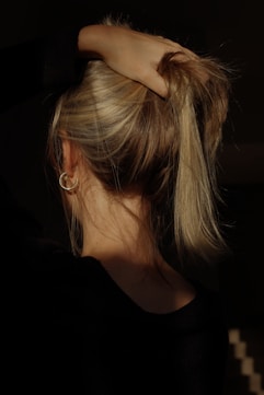 a woman with her hair in a bun