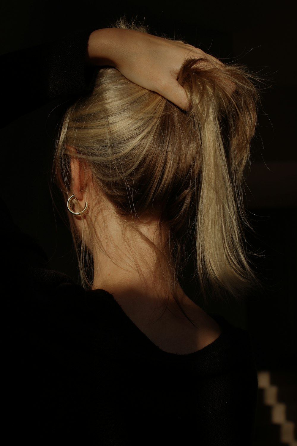 a woman with her hair in a bun