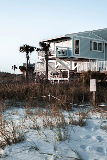 A cozy beachfront vacation home with sunset views and a welcoming porch.