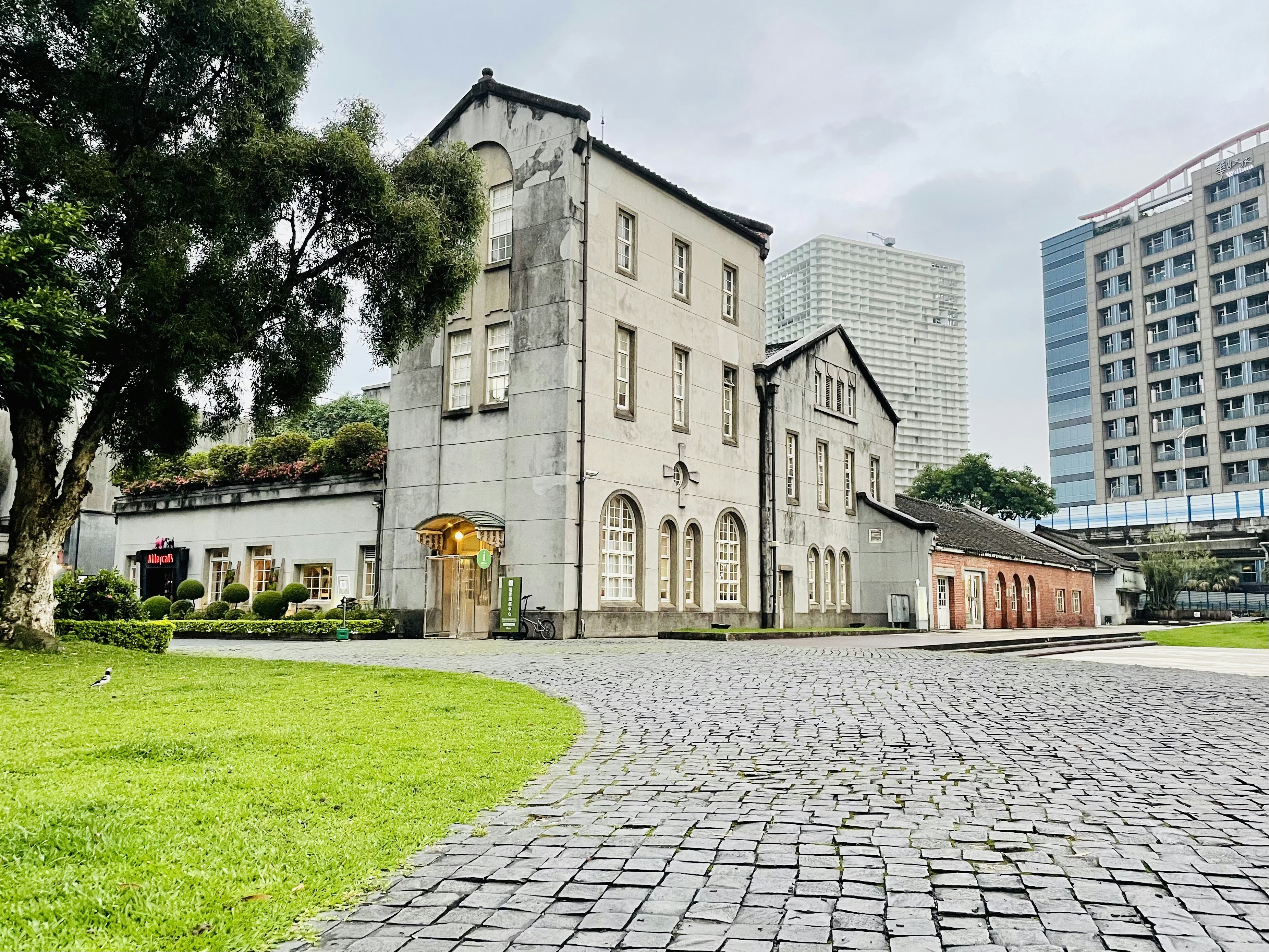 a brick road leading to a building