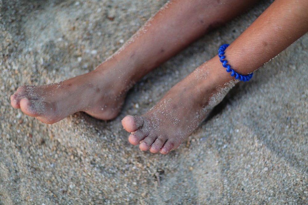 a pair of feet with sand