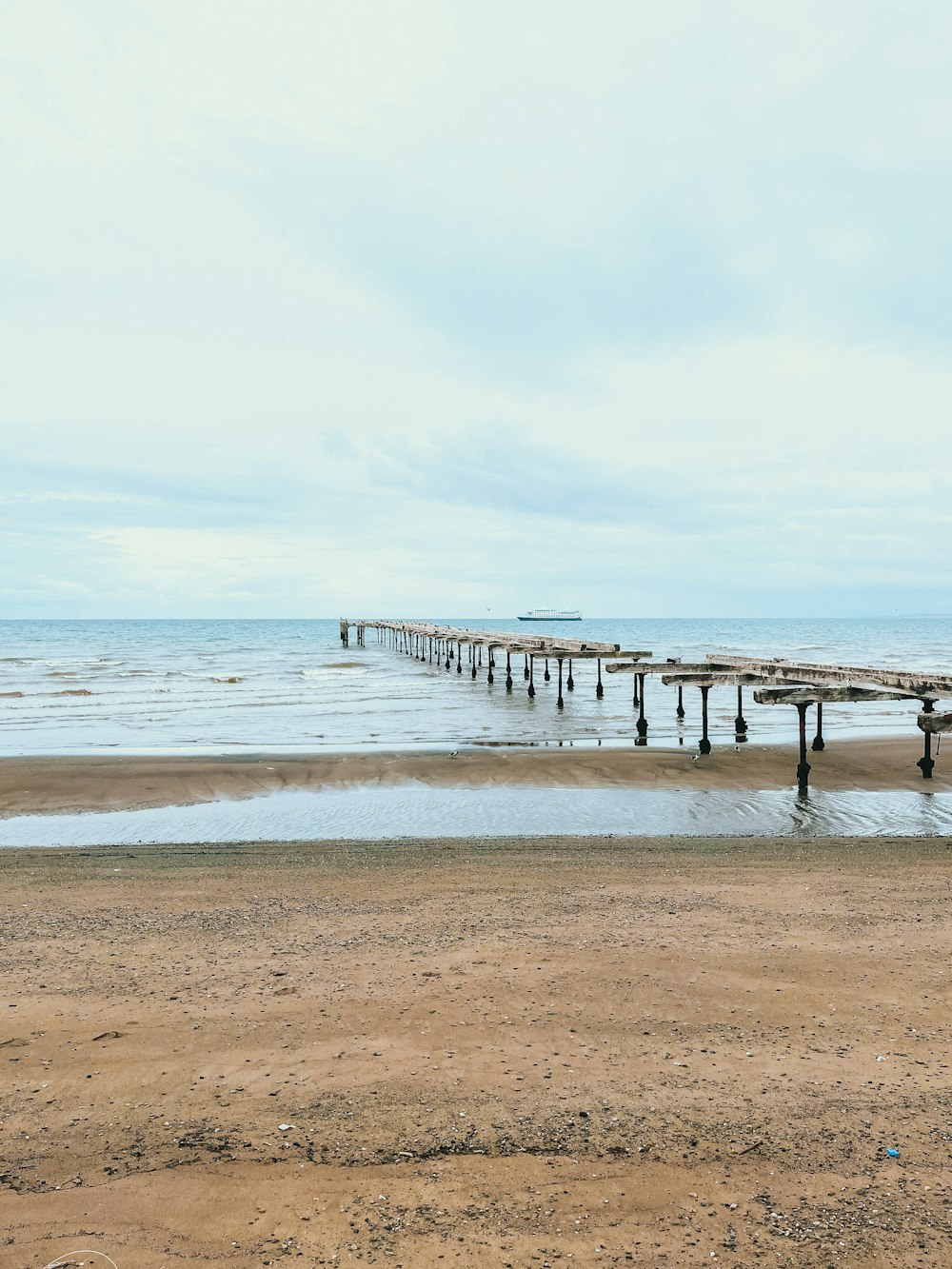 a pier on a beach