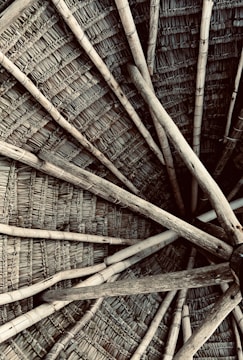 Close-up of handcrafted wooden beams and woven bamboo ceilings highlighting local craftsmanship.