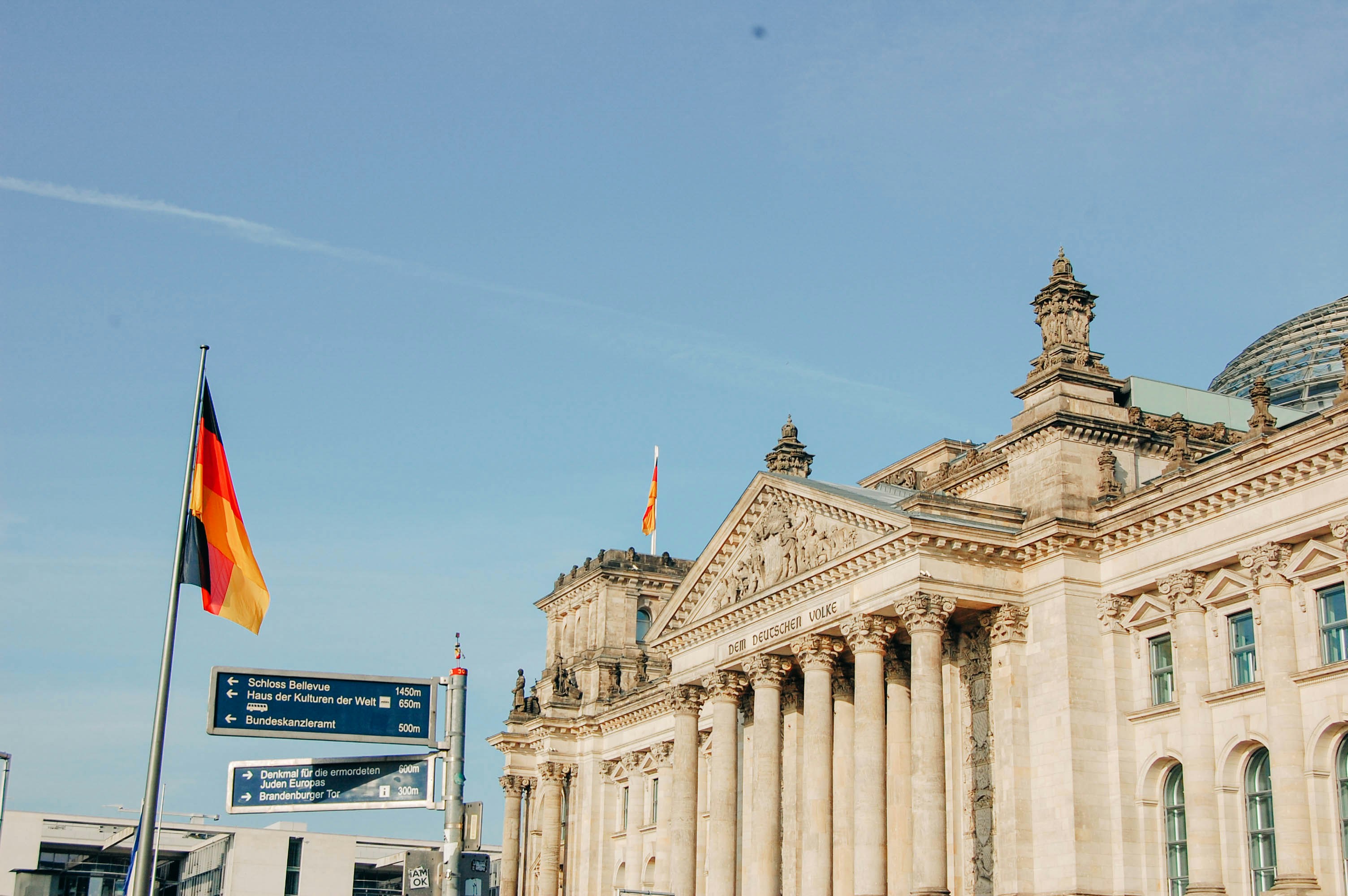 a building with columns and a flag