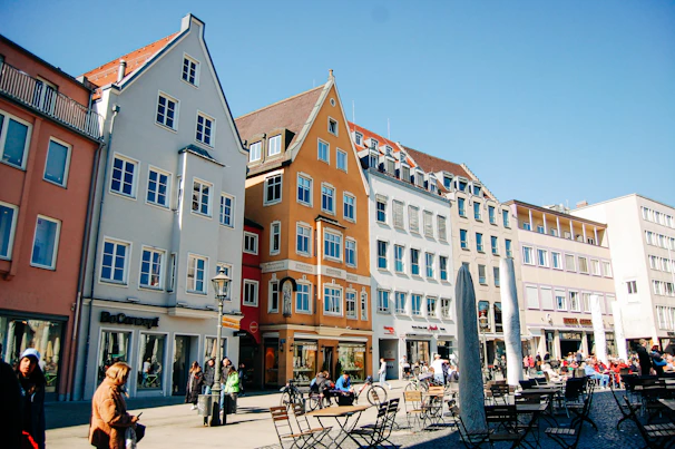 Historic city square with charming old buildings and lively outdoor cafes.
