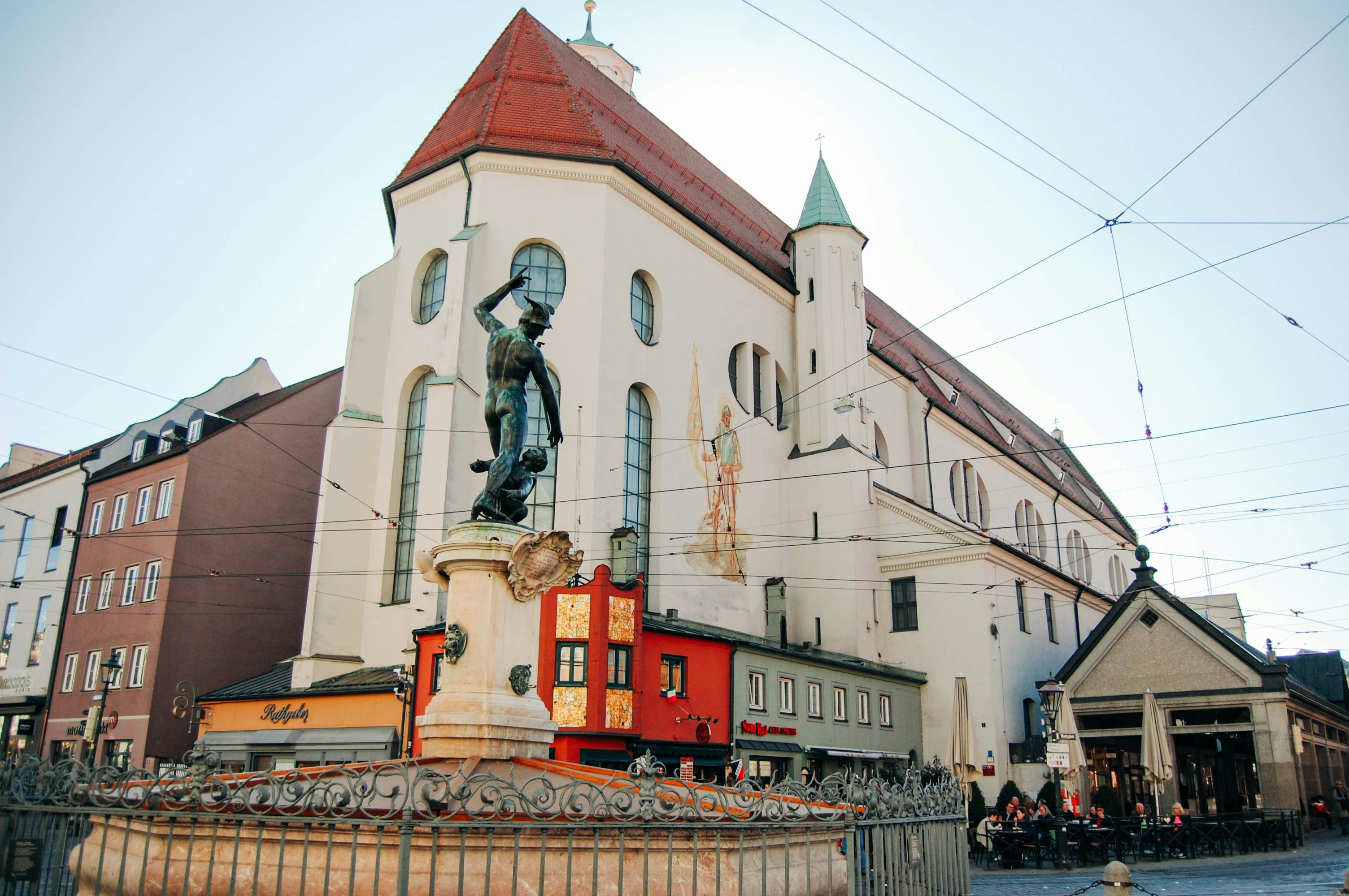 a large building with a statue in front of it
