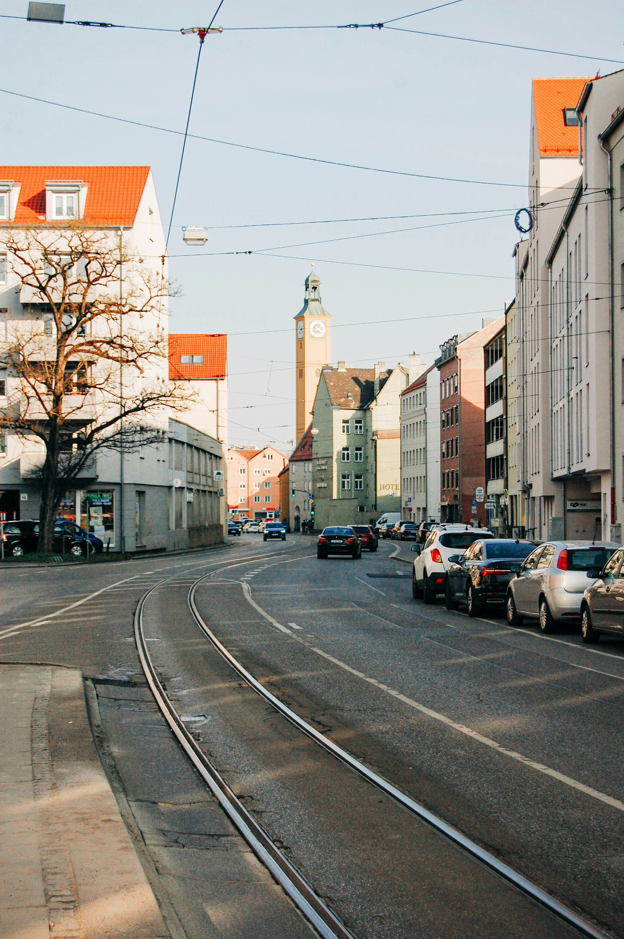 a street with cars and buildings along it