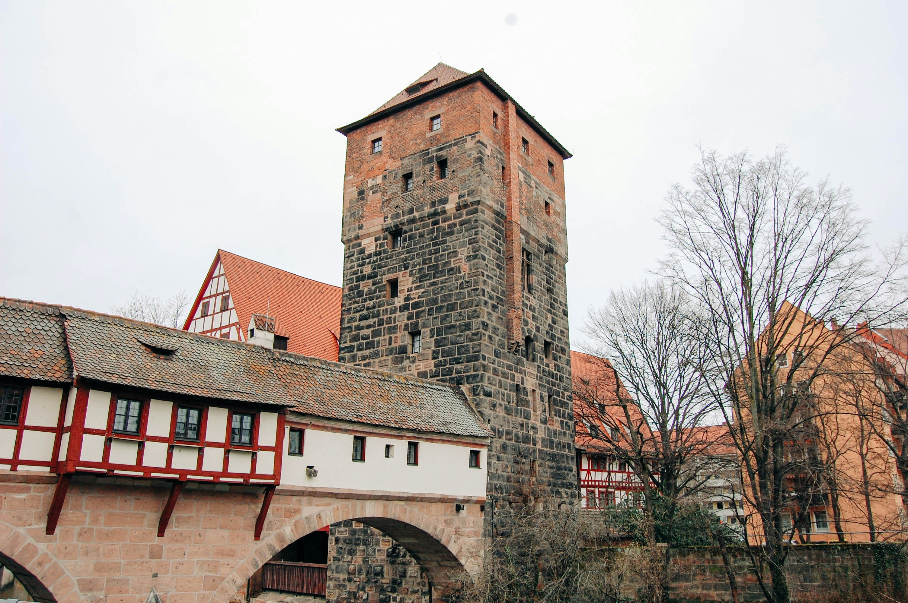 a brick tower with a bridge