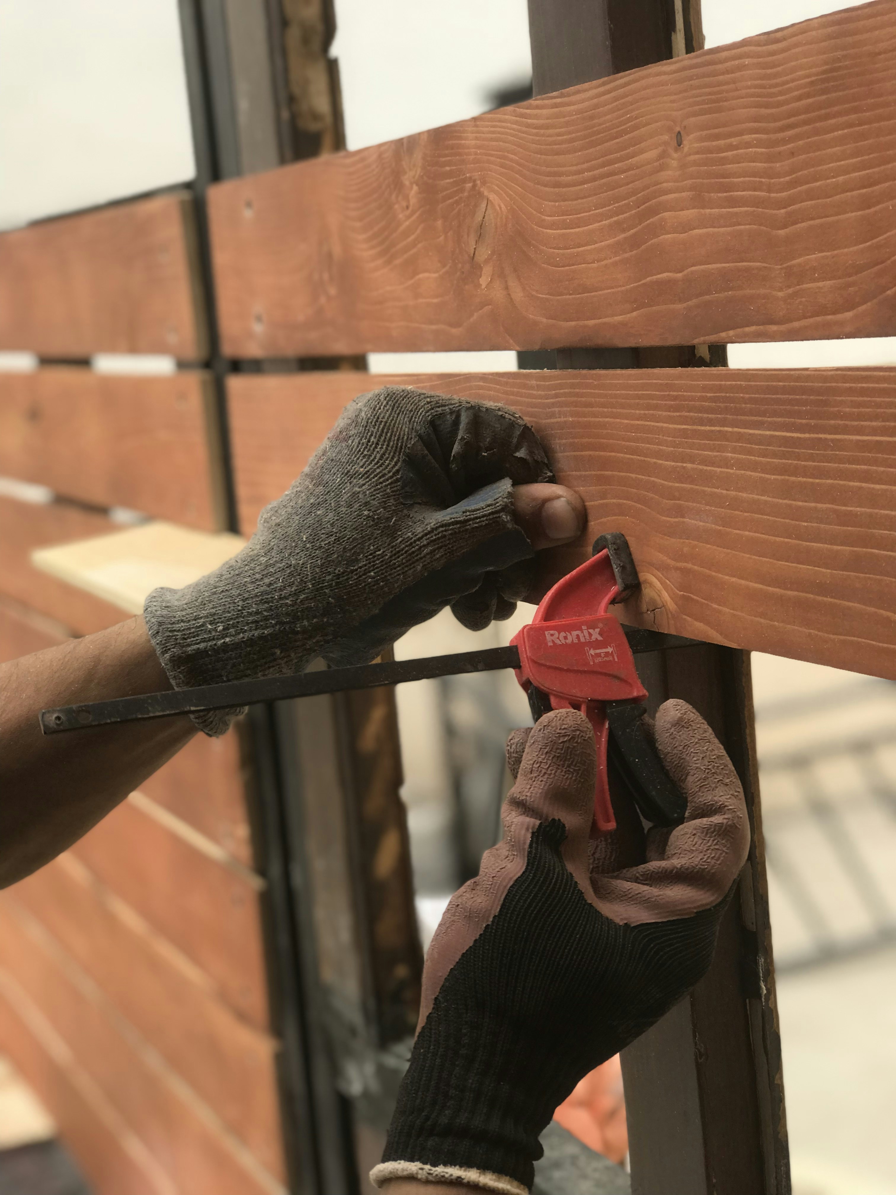 applying sealant fence