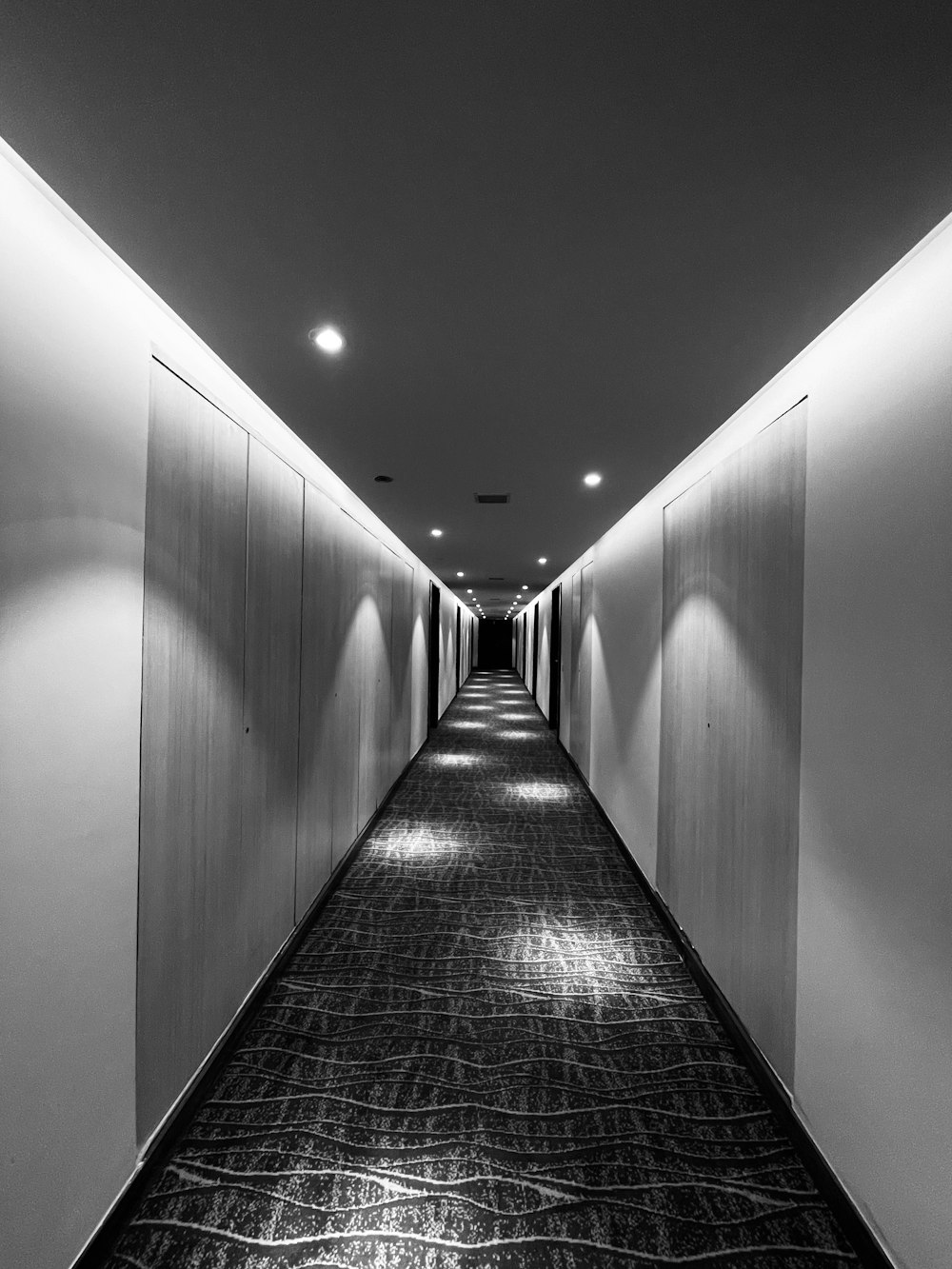 a long hallway with lights