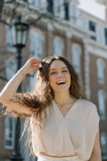 a woman standing in front of a building