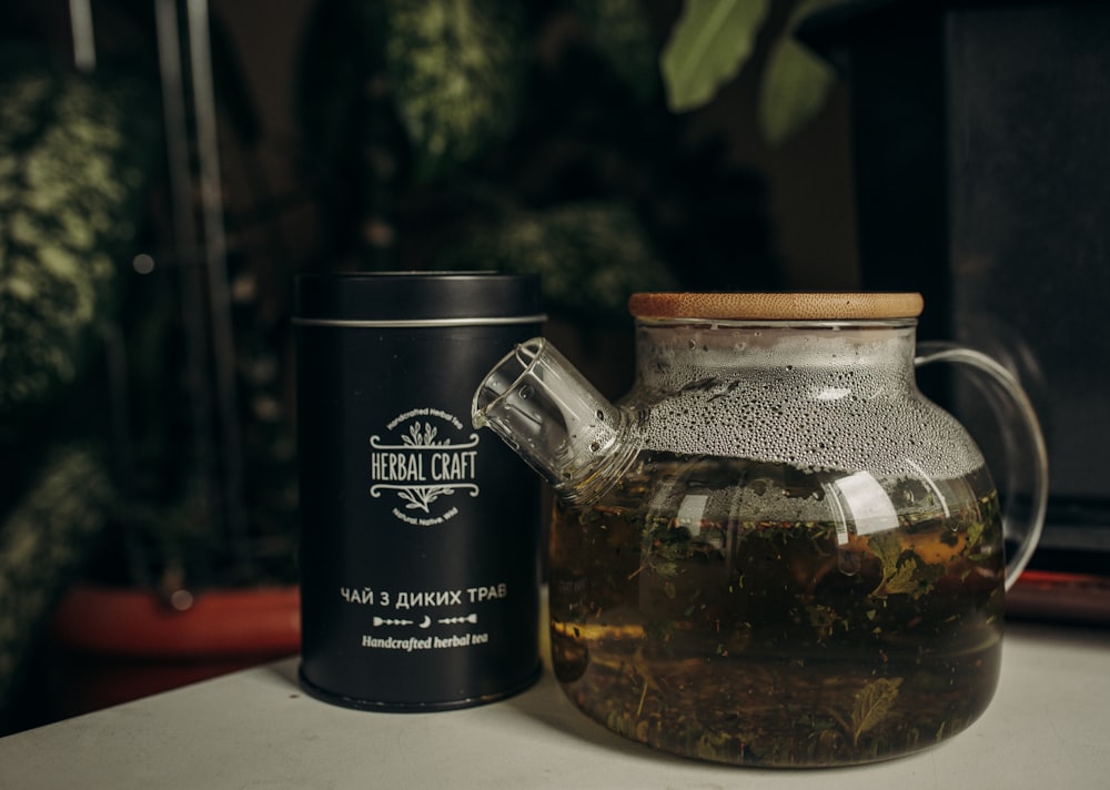 a glass jar with a brown liquid in it