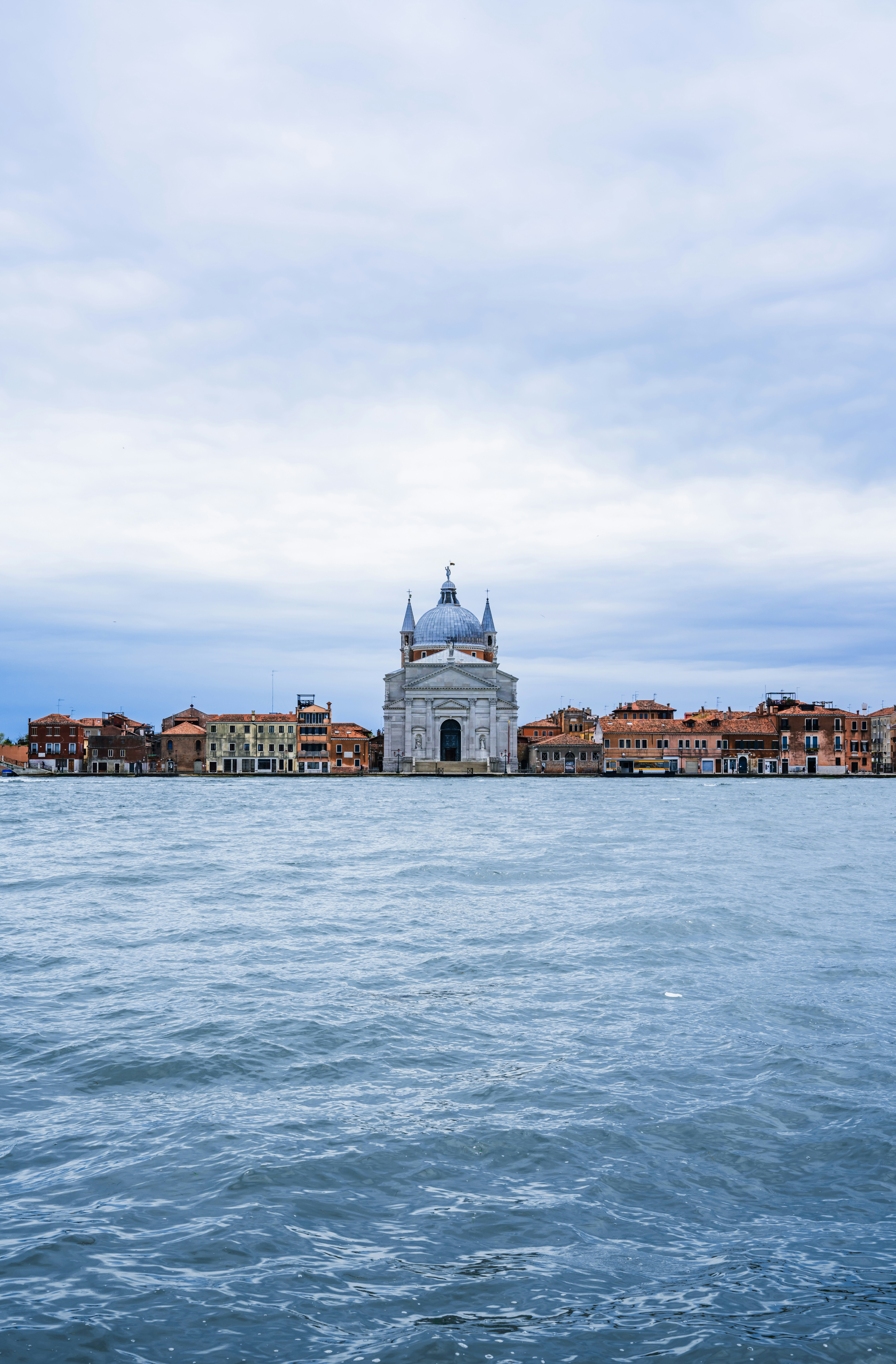 a body of water with buildings along it