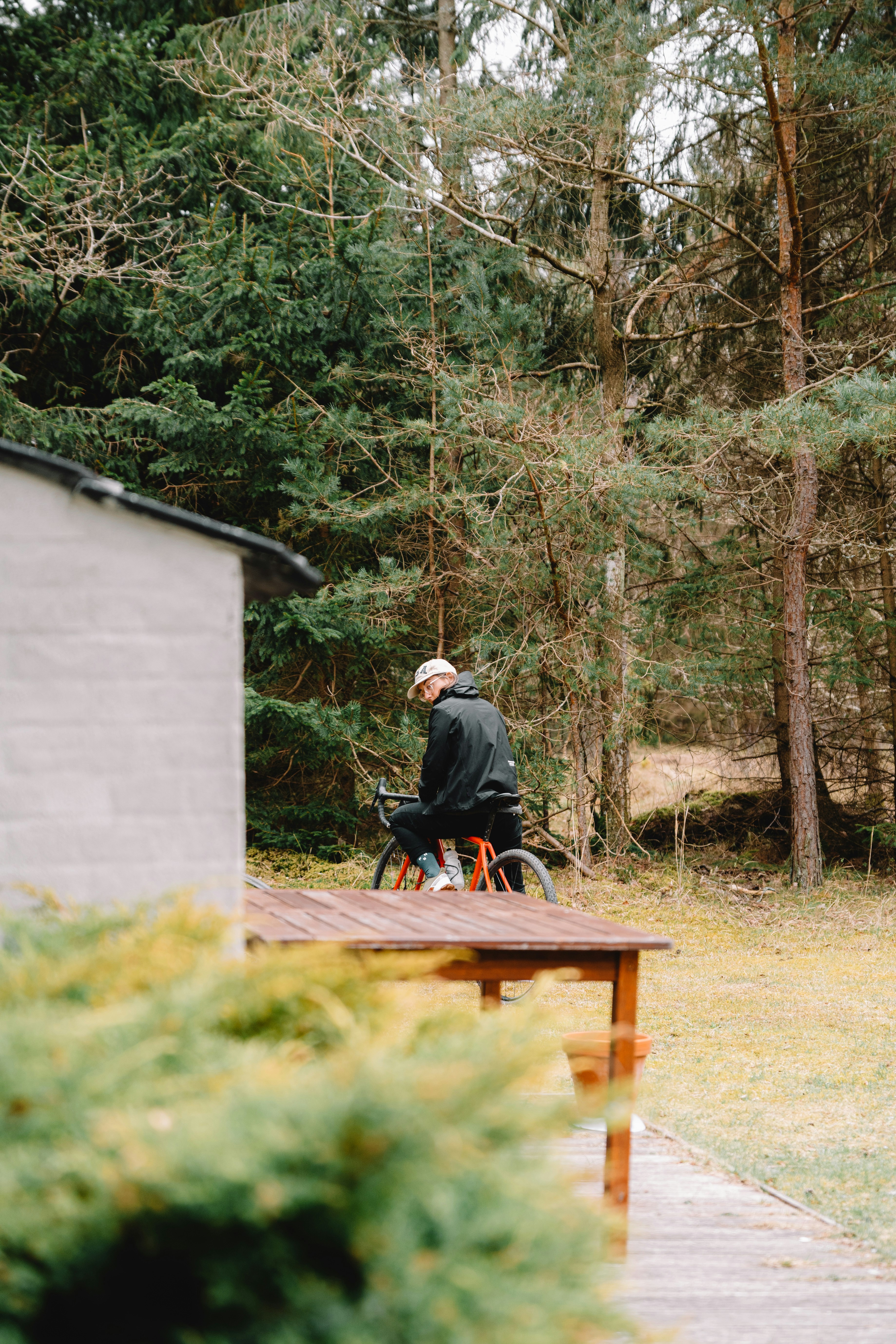 a man sitting at a table outside