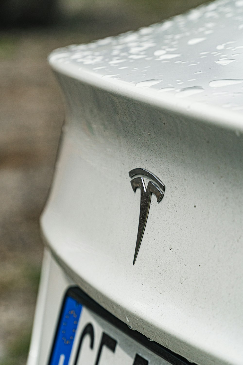 a close up of a key on a car's license plate