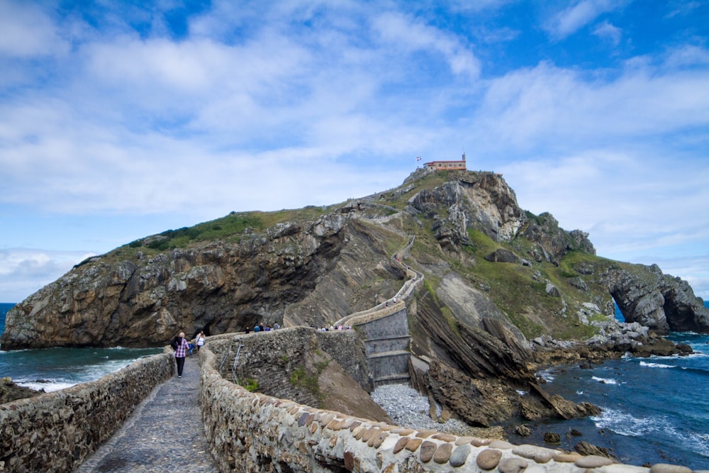 a stone wall on a cliff