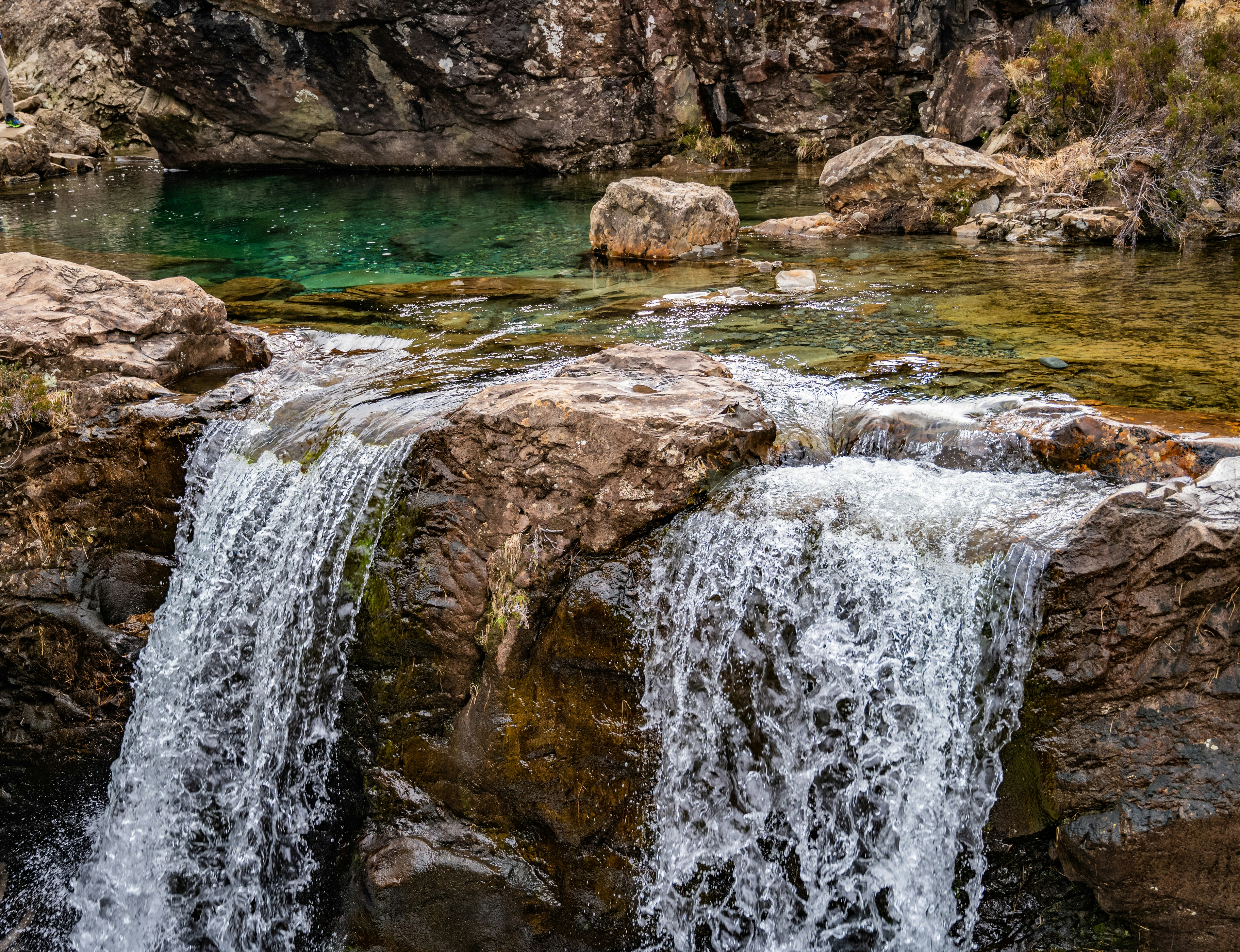 A waterfall over rocks photo – Free Grey Image on Unsplash