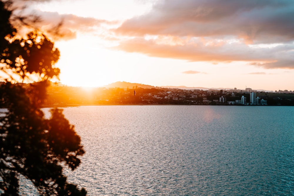 a sunset over a body of water