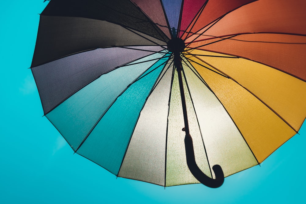 a colorful umbrella with a black handle