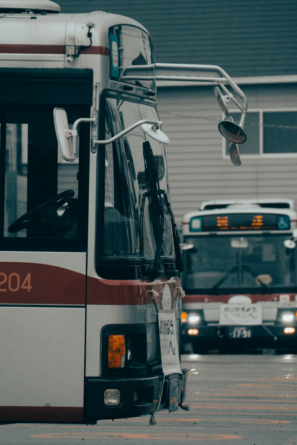 a passenger bus that is parked on the side of a road