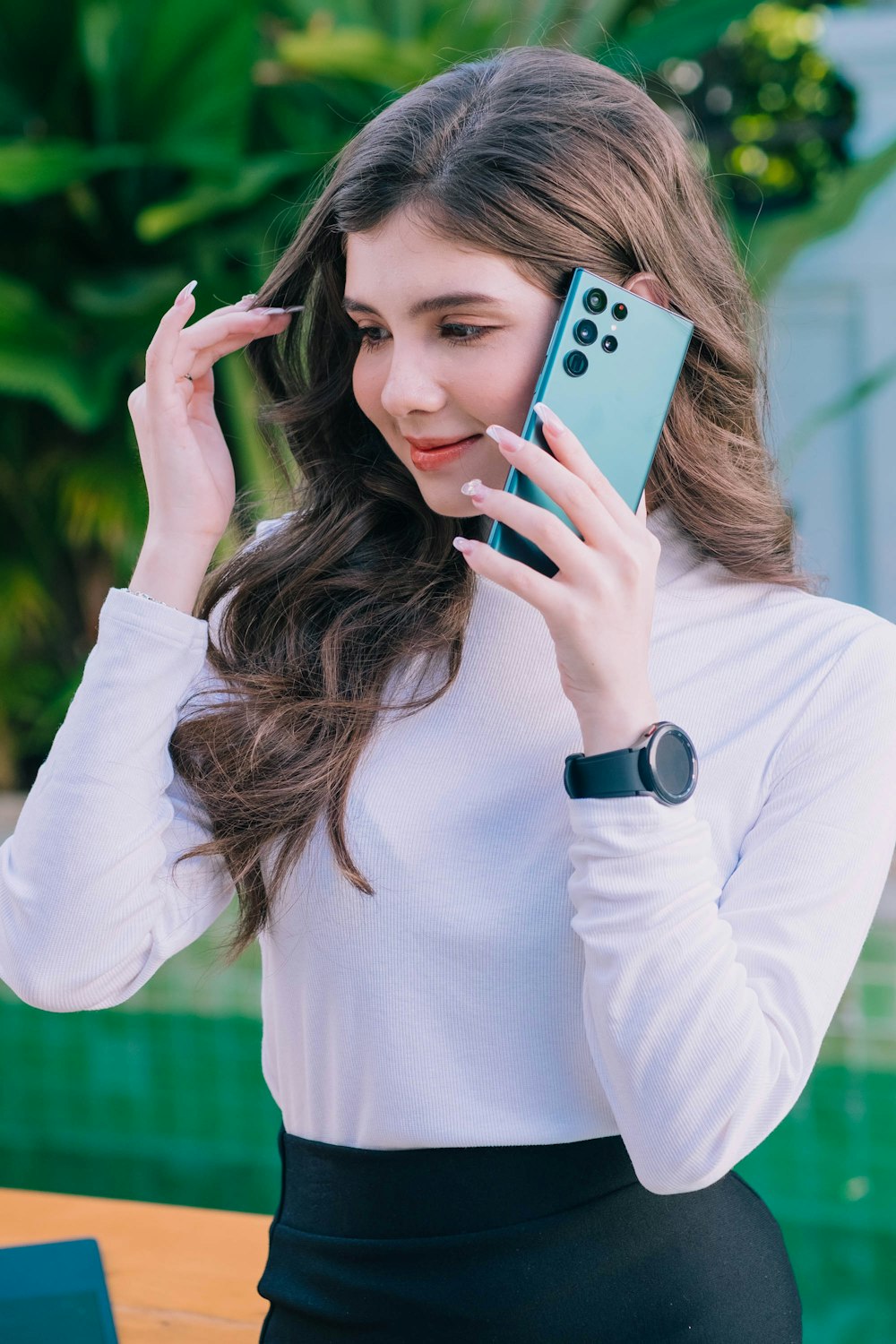 a woman holding a phone