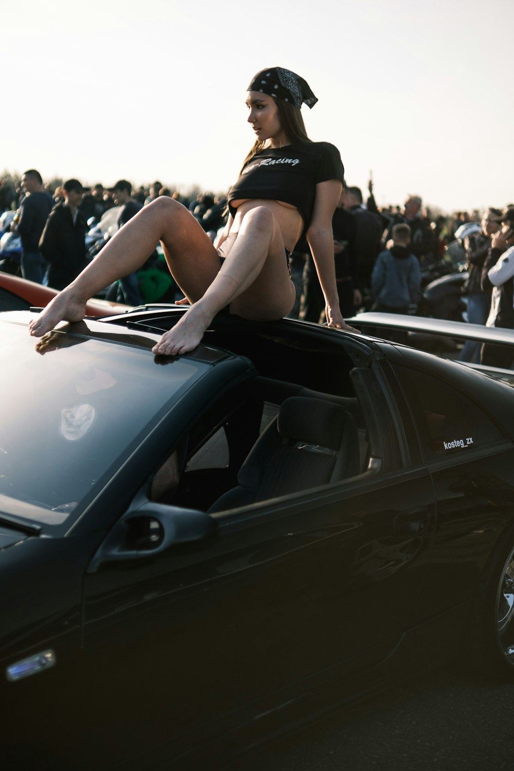 a person sitting on a car