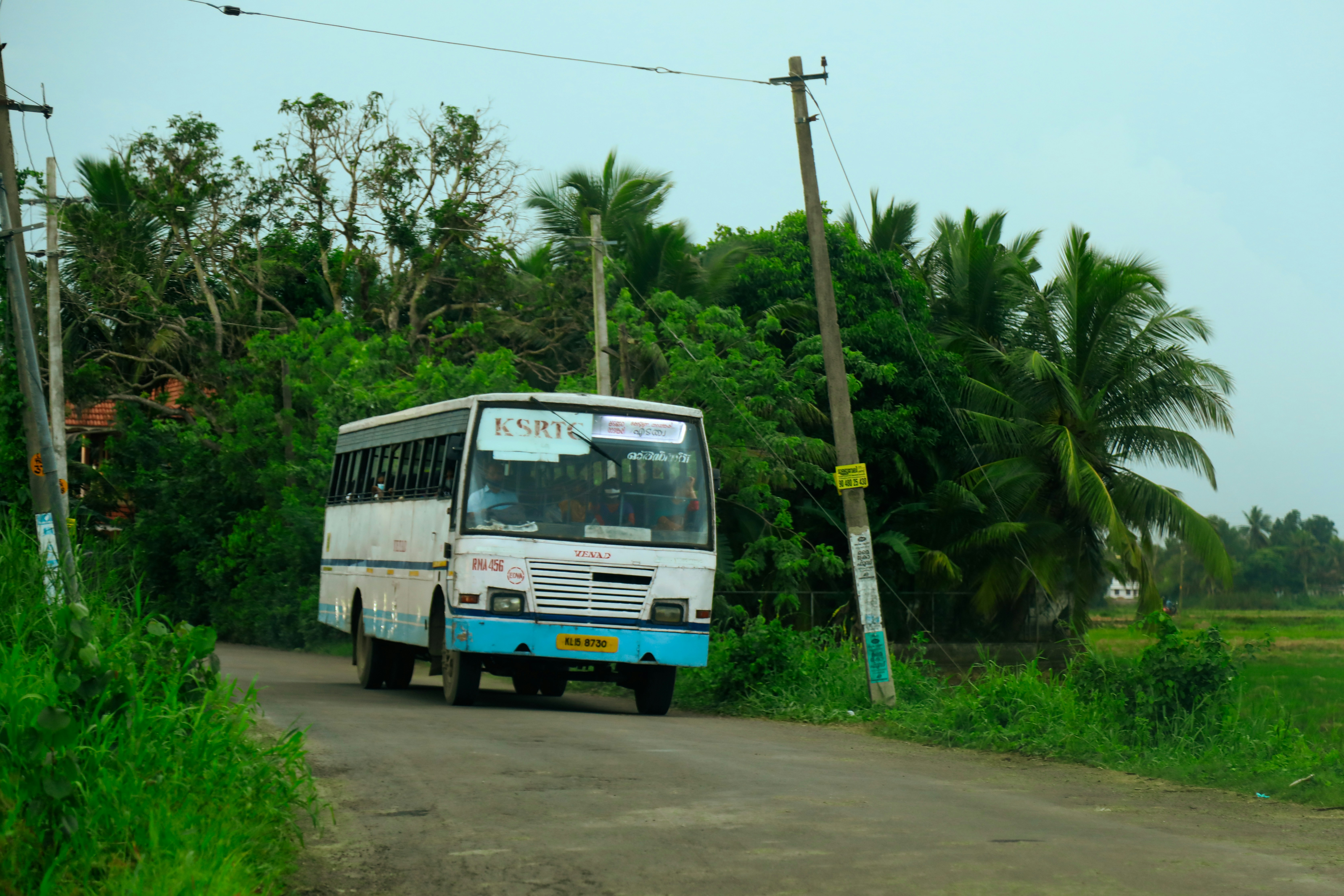 a bus travels down the road