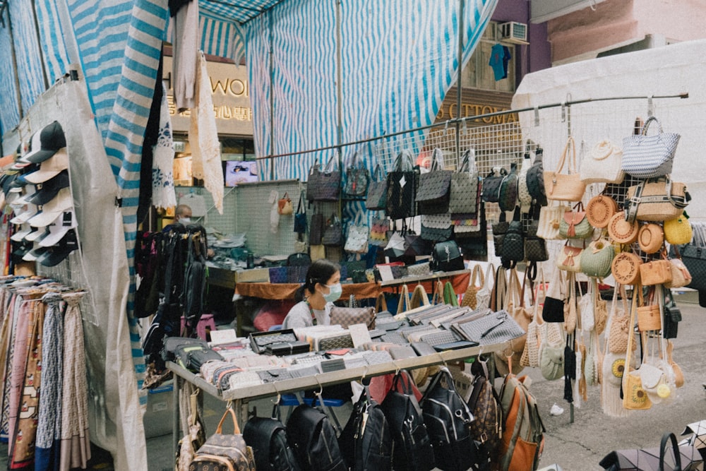 a person selling hats in a shop