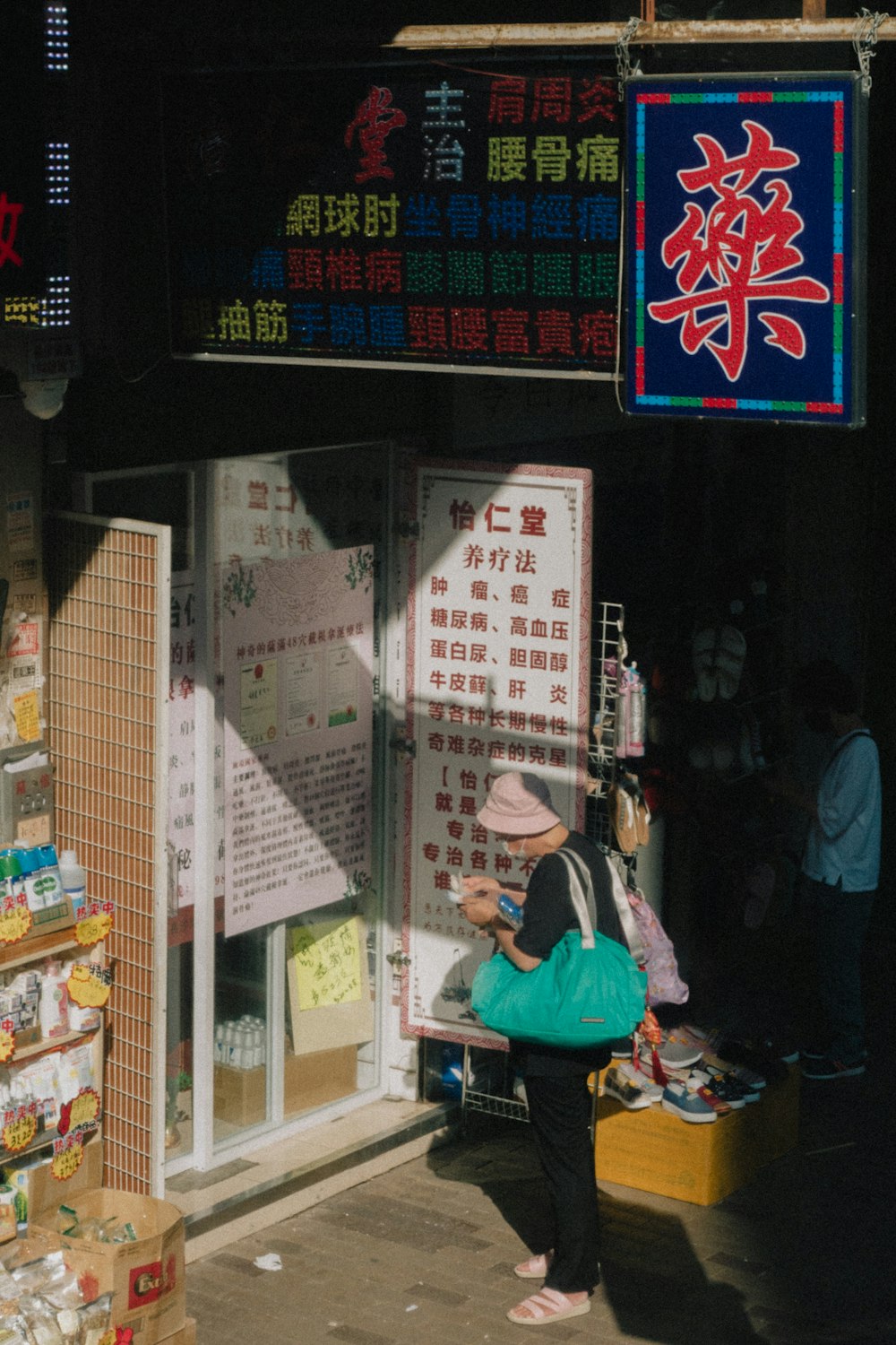 a person standing in front of a storefront