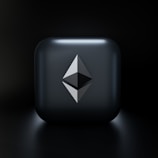 A sleek, modern design featuring a three-dimensional geometric shape resembling the Ethereum logo, centered on a glossy dark gray square with subtle lighting effects. The background fades into a deep black, highlighting the central emblem.