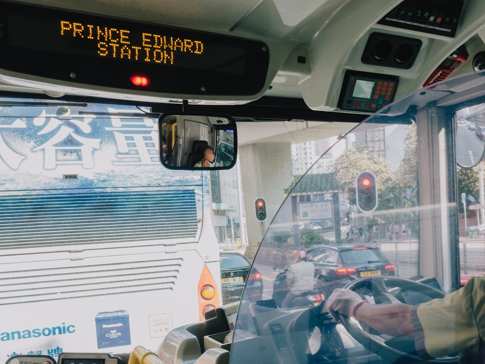 a bus with a person in the driver seat