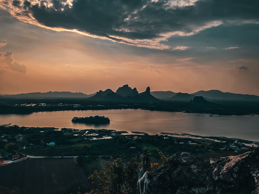 a body of water with land in the back