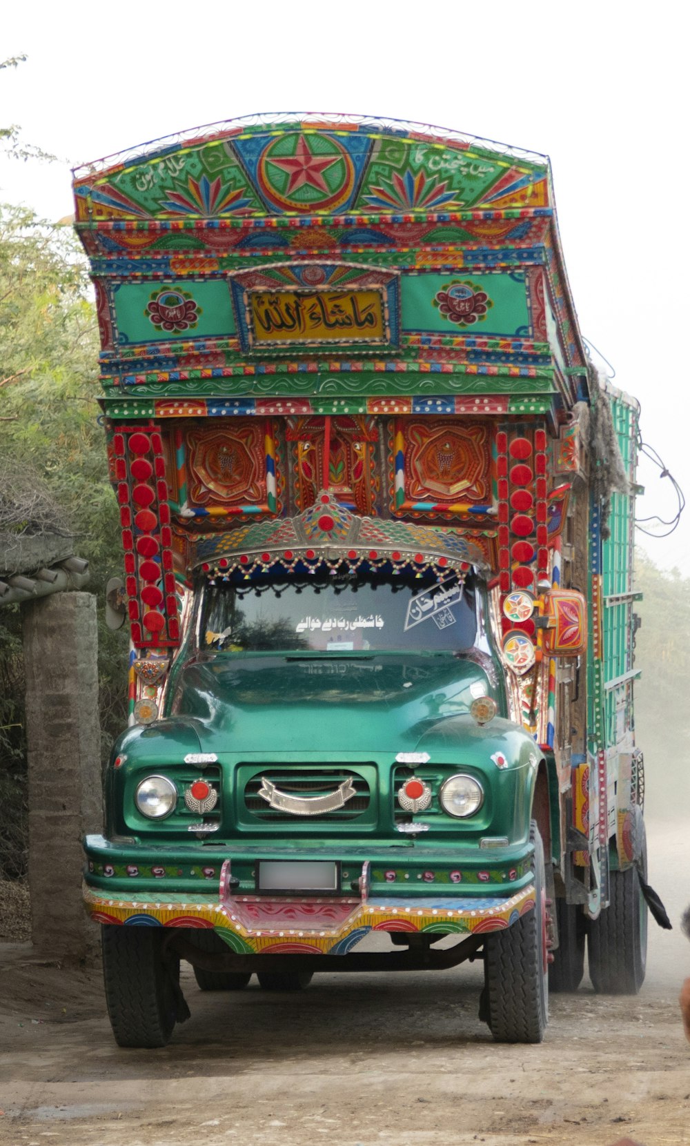 a green truck with a colorful display
