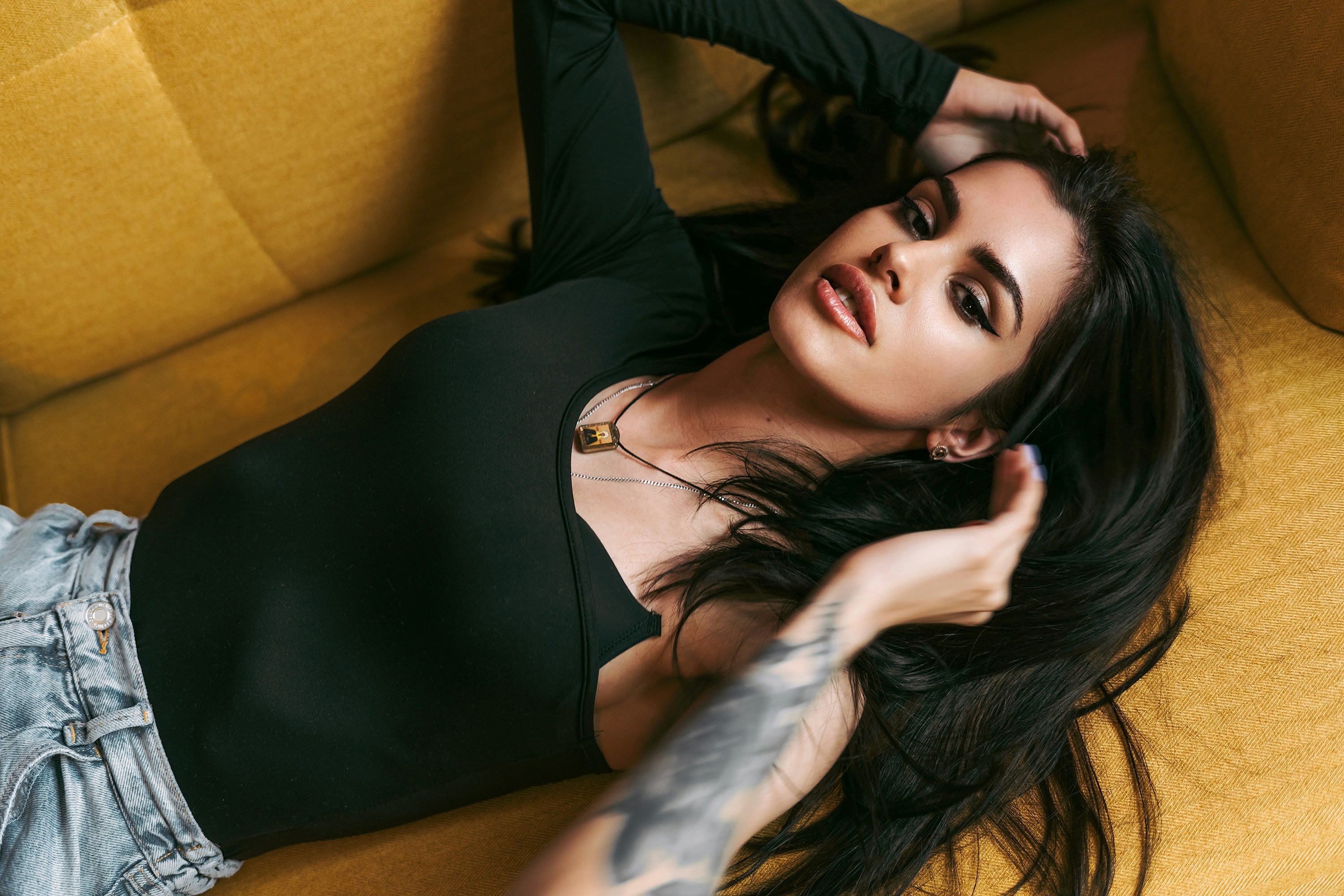 a woman lying on a couch