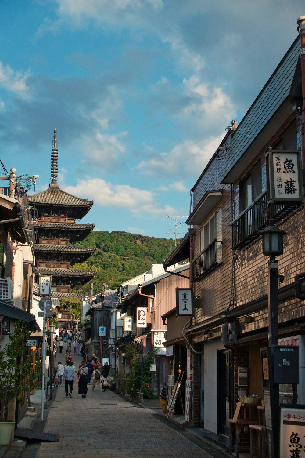 a street with buildings and people