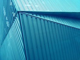 Abstract photo of Brasília's government buildings with soft teal highlights.