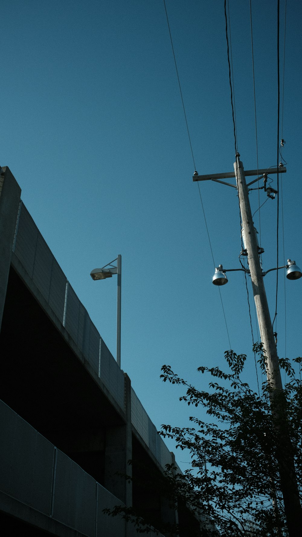 a building with a pole and street lights