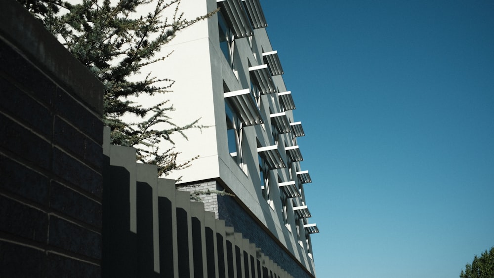 a building with a tree in the front