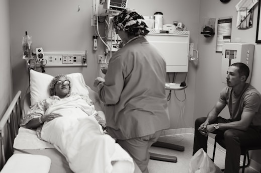 A hospital room showing an inpatient receiving care.