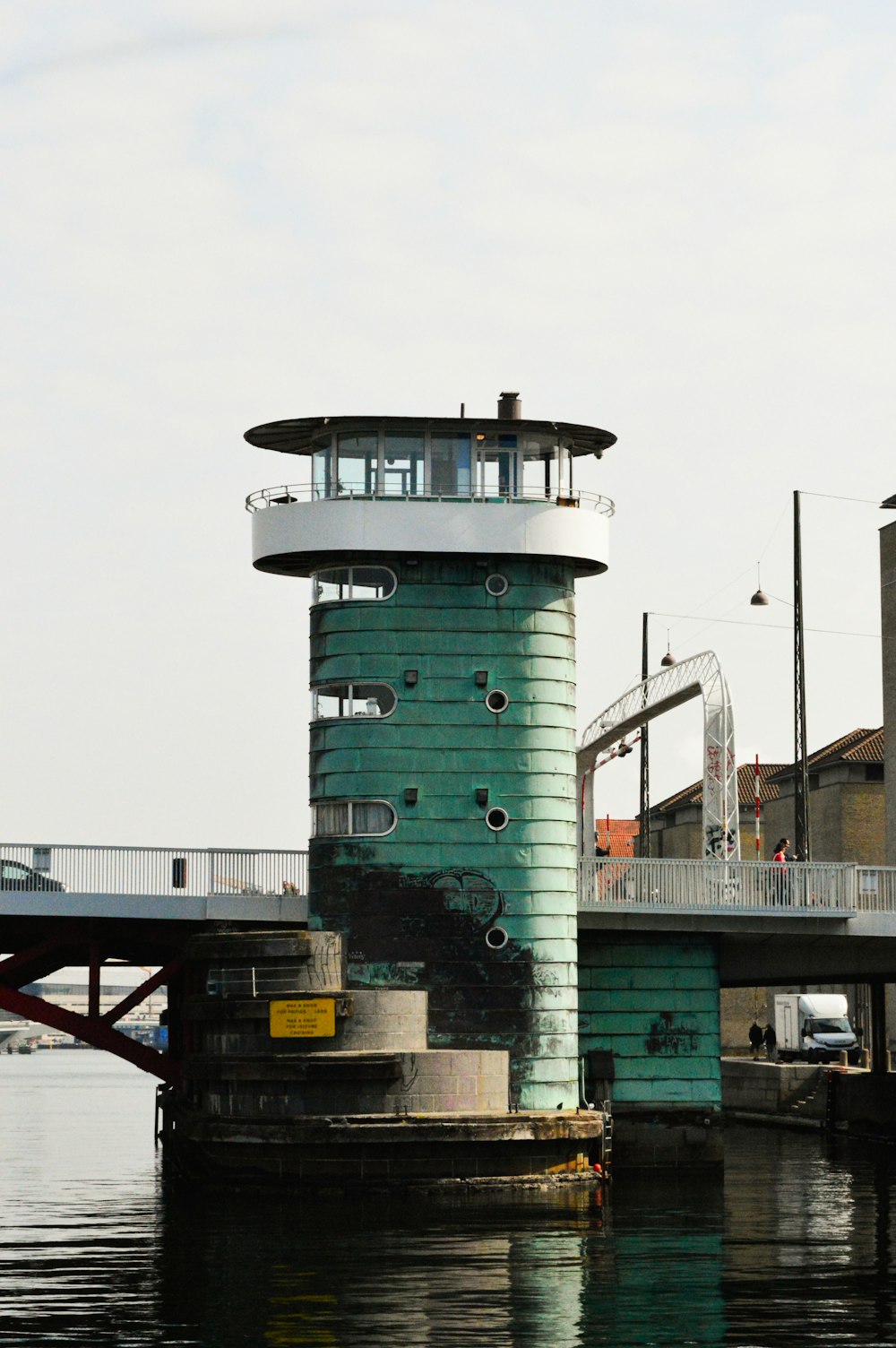 a lighthouse on a dock