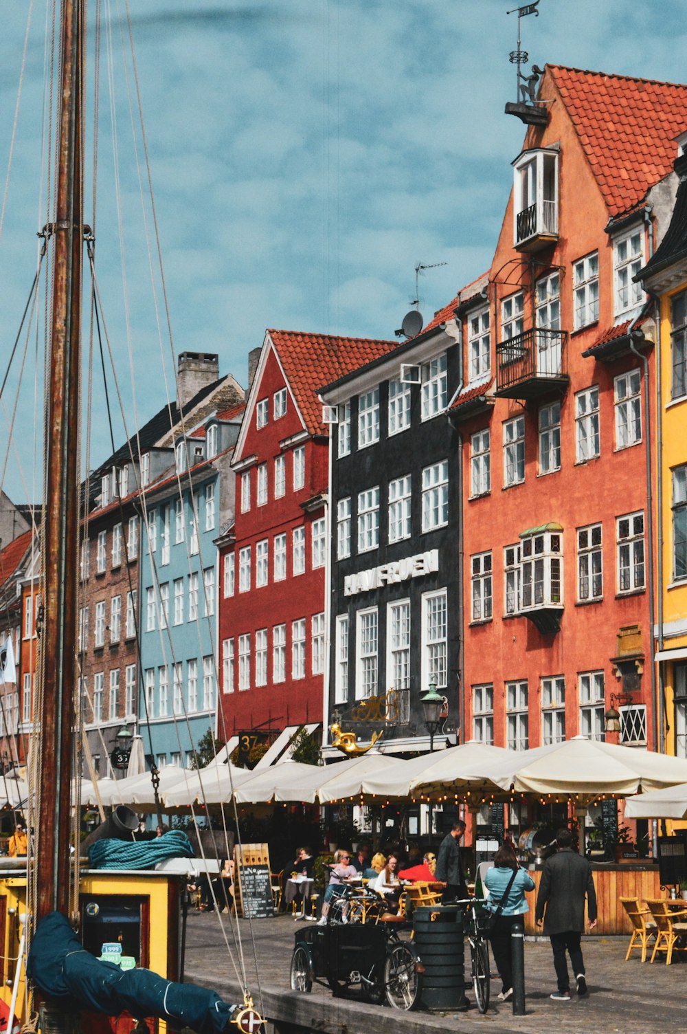 a group of buildings with people walking around