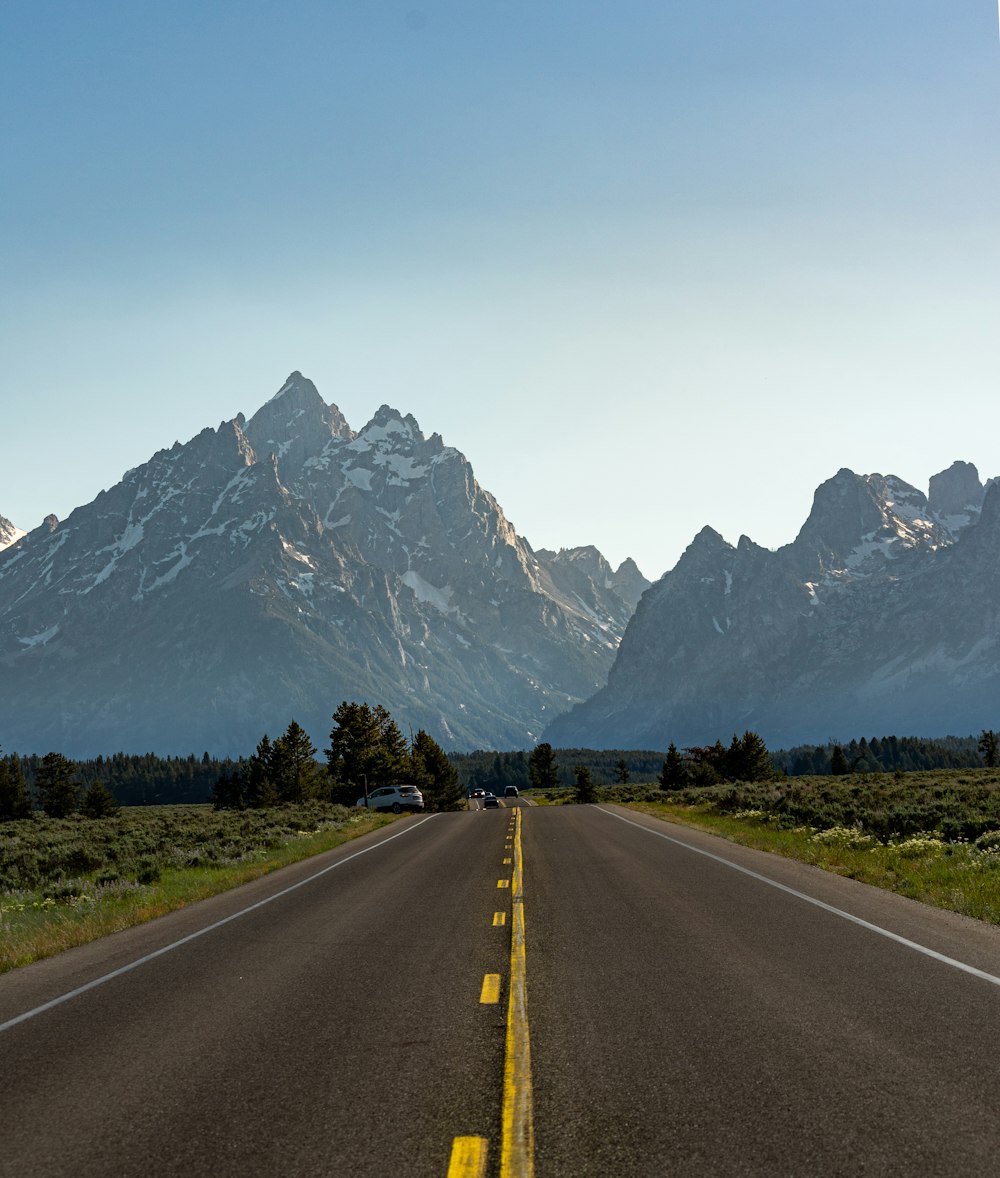 a road with a mountain in the background