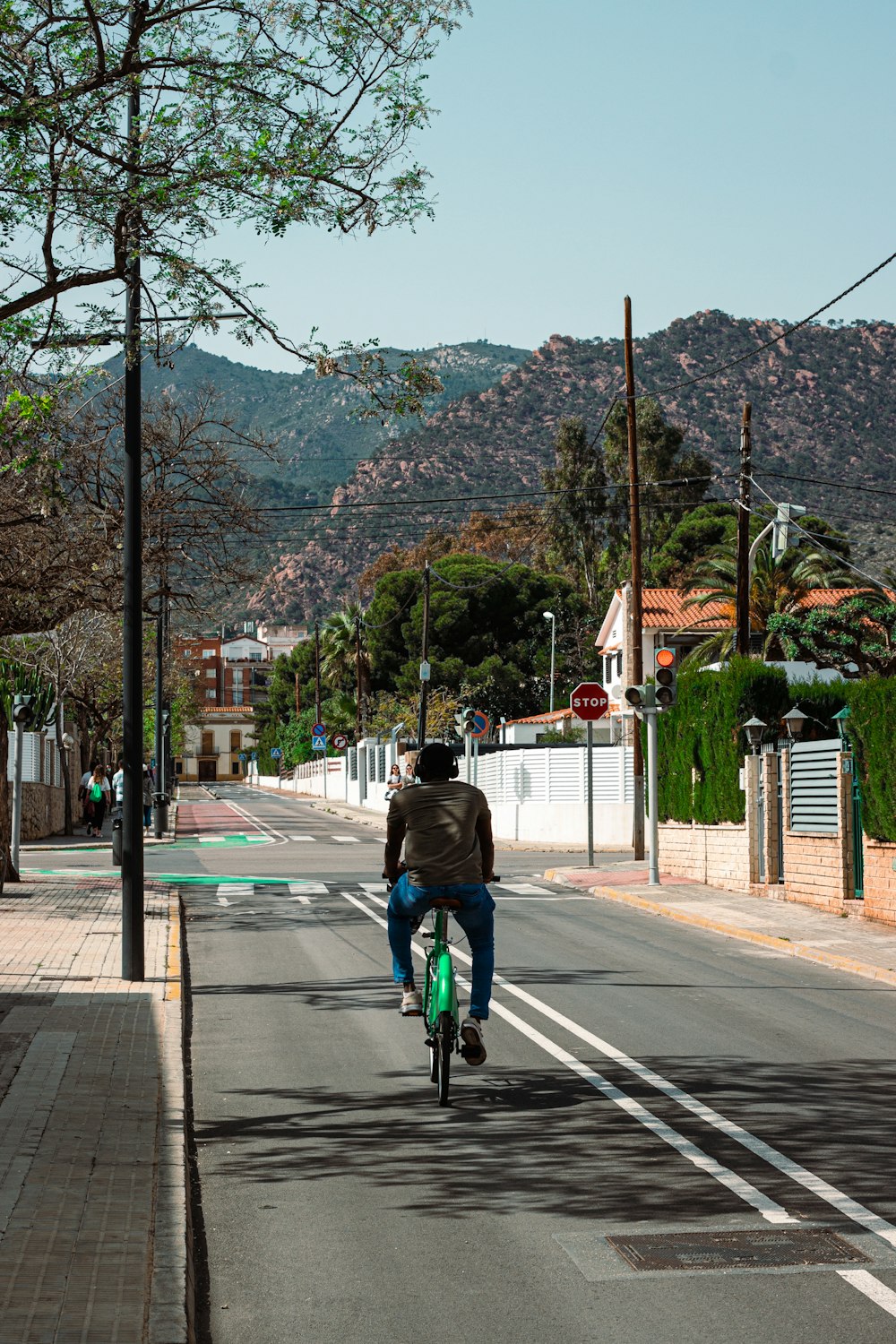 a person riding a bicycle on a street